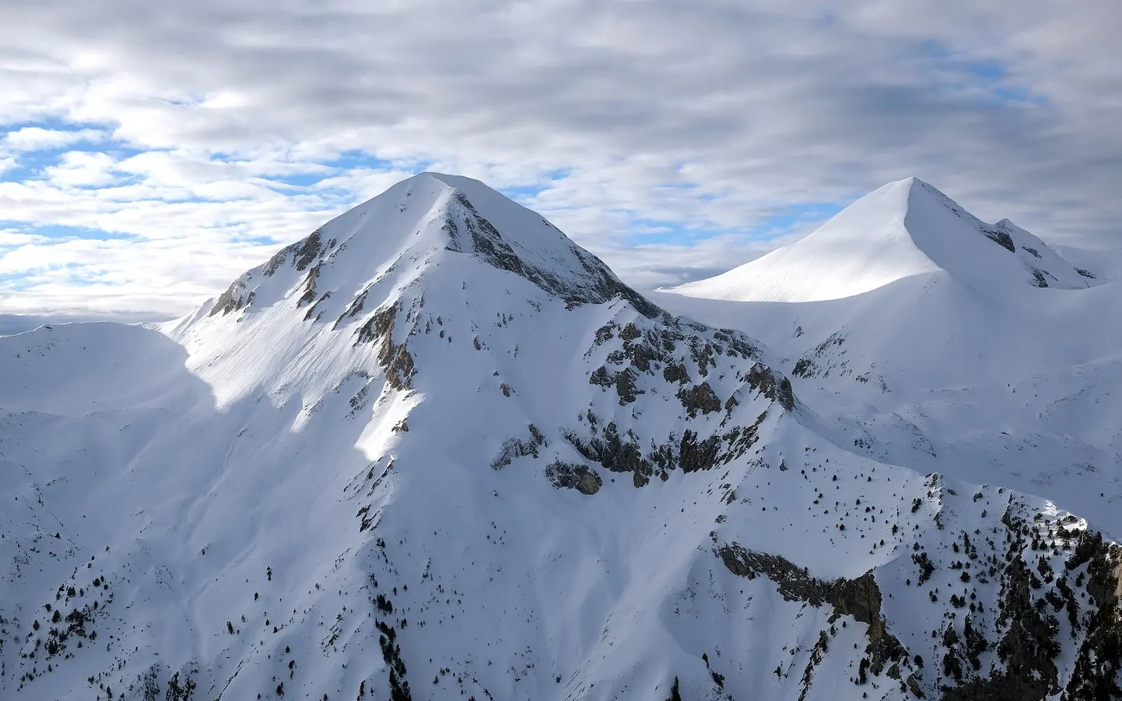 View of Vihren, the highest peak of Bulgaria's Pirin Mountains, from Bansko ski center. Kutelo peak on the right.