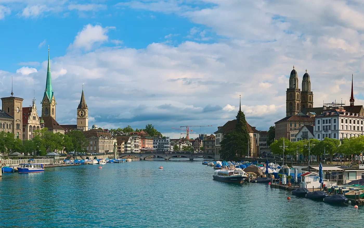 High-resolution view of Zurich from the Quaibrücke, downstream the Limmat river. This view shows some of the most important landmarks in Zurich in one picture: The towers of Fraumünster, Grossmünster and St. Peter (whose
