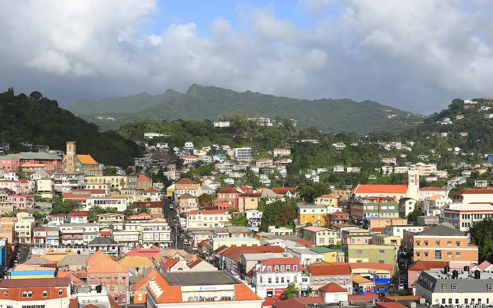 Late afternoon view of St. George's , Grenada , with the Catholic Immaculate Conception Cathedral to the left, and Anglican St. George's Parish Church to the right.
