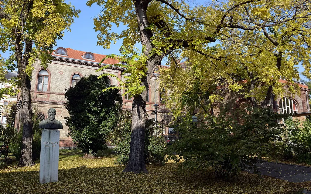 The building of the Pathological Faculty in the campus of the former University of Veterinary Science, Budapest. Statue of Béla Tormay in the foreground.