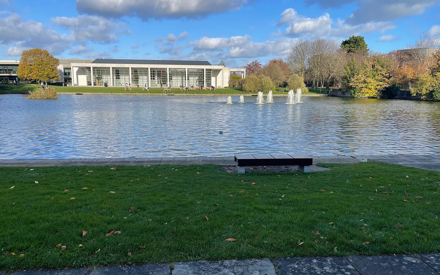 This is a picture of the University College Dublin campus, It shows the O’Riley building and the lake.