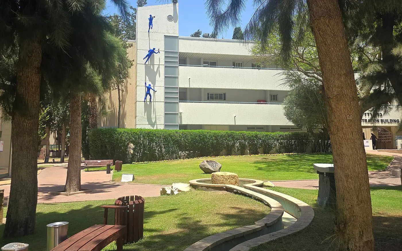 Name: Reichman University Herzliya Description: A statue of Ofra Zimbalista on a wall of a building in the garden complex at Reichman University in Herzliya