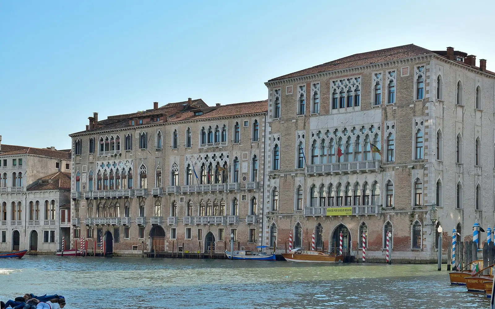 Ca' Foscari right and Palazzo Giustinian left in Venice . Facade on Grand Canal.