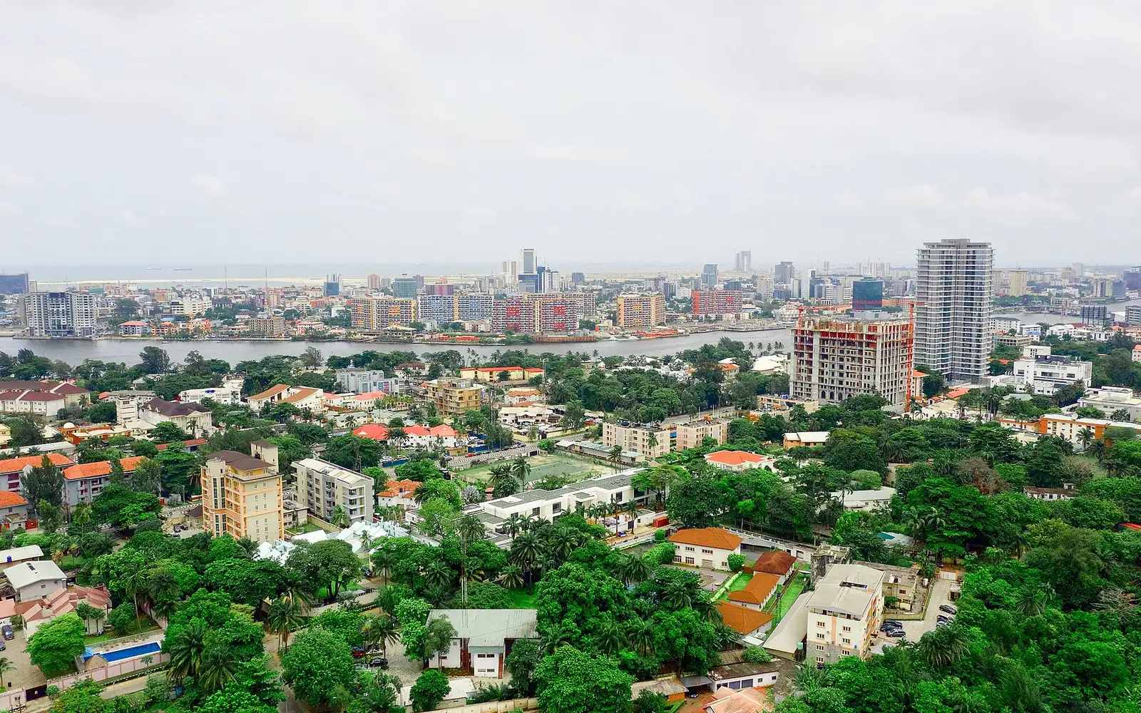 This is an aerial shot using the DJI Mavic Pro 2 drone. The area is a part of Ikoyi, an upper-class suburb of the sprawling megacity called Lagos, in Nigeria. Beyond the Lagoon is Victoria Island, and beyond that is the 