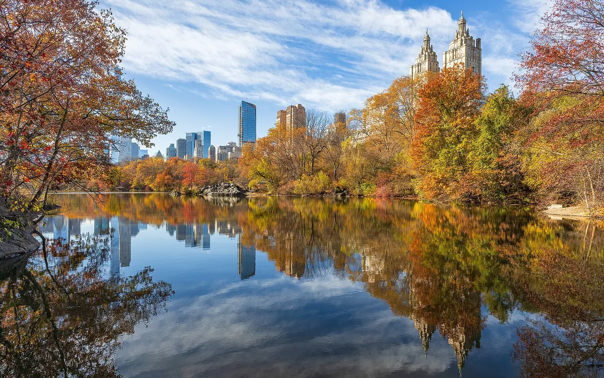 View over The Lake (Central Park) to Building San Remo in autumn.