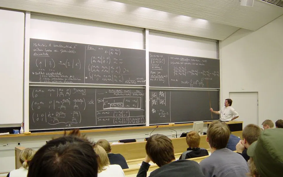 A mathematics lecture, apparently about linear algebra (calculation of eigenvalues and eigenvectors), at Helsinki…